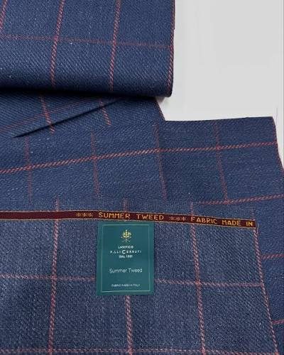 Navy Cerruti cloth with a fine red overcheck, rolled, with the Lanificio Cerruti ticket