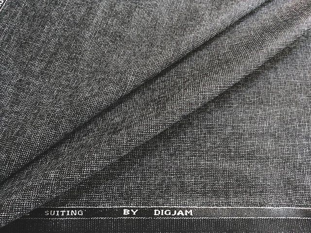 Grey Digjam suiting folded to show the Suiting by Digjam woven selvedge