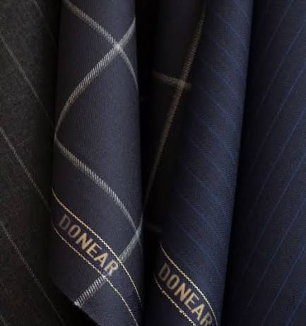 Navy Donear windowpane and pinstripe bolts with the Donear name woven in gold