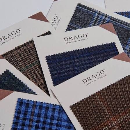 Drago swatch cards in checks and blues fanned across a table