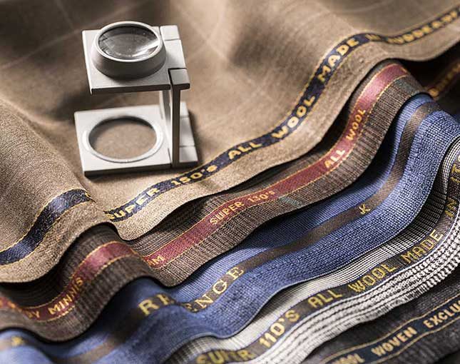 A linen tester resting on tan and checked cloth from a Gladson bunch
