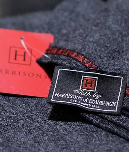 Grey worsted with the Cloth by Harrisons of Edinburgh tag pinned to it