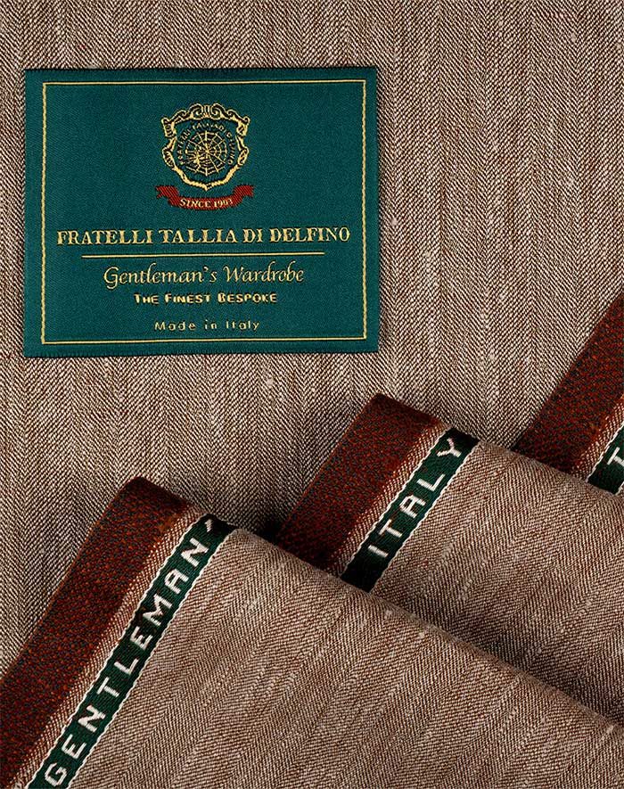 The green Fratelli Tallia di Delfino Gentleman's Wardrobe woven label on cloth