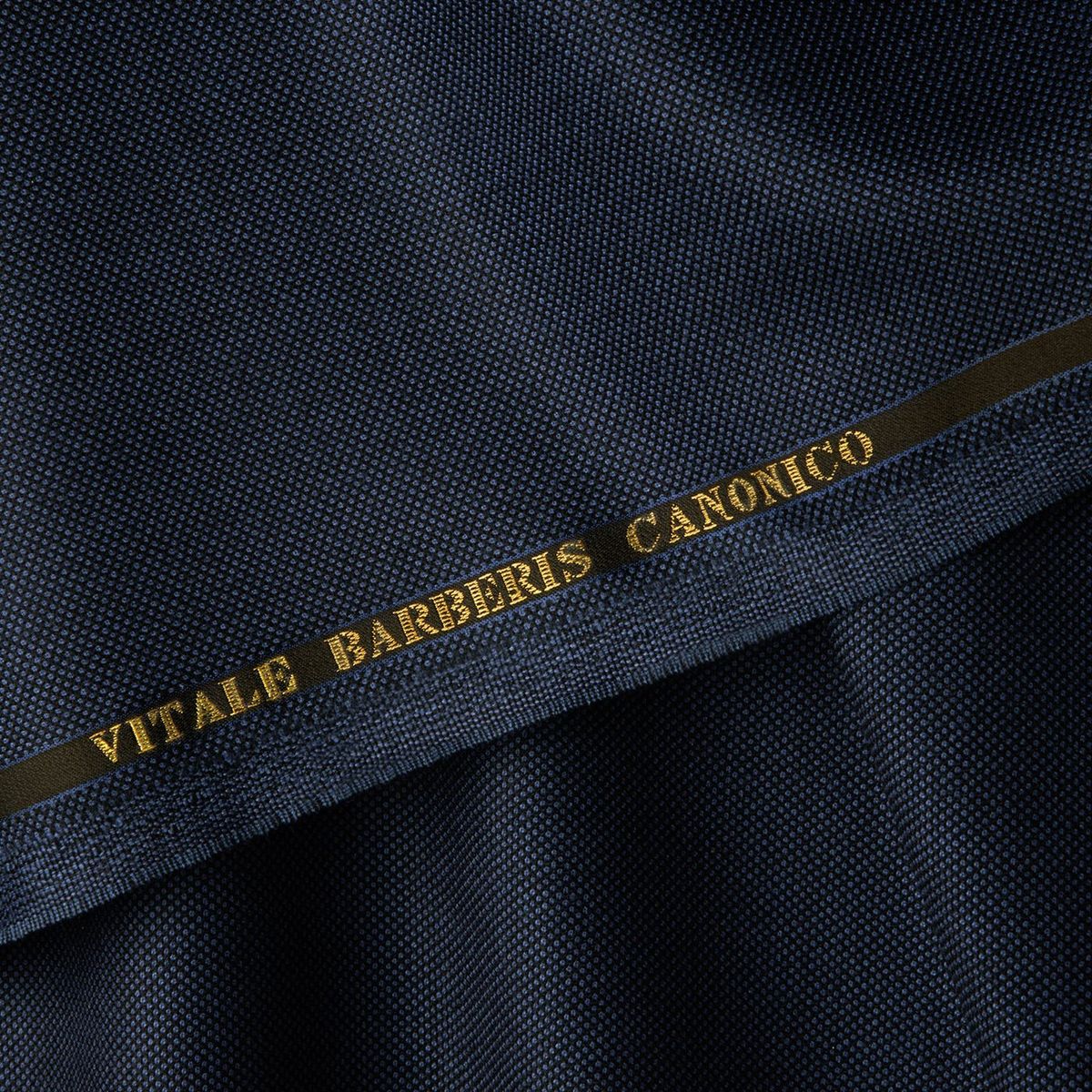 Dark navy Vitale Barberis Canonico cloth with the mill name woven into the gold selvedge